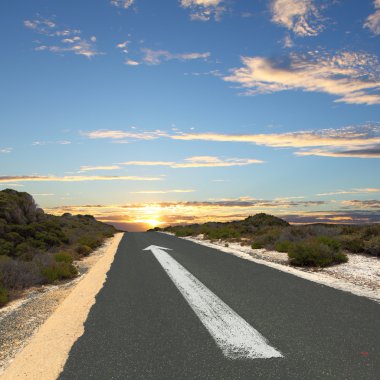 Empty countryside road with white arrow clipart