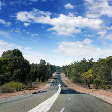 Empty countryside road with white arrow clipart