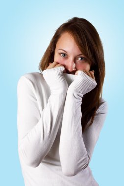 Young girl in white sweater