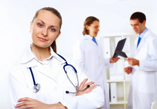 Friendly doctor in medical office — Stock Photo, Image