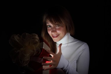 Young woman reading a magic book