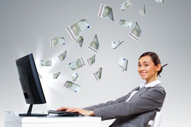 Businesswoman at workplace and money symbols clipart