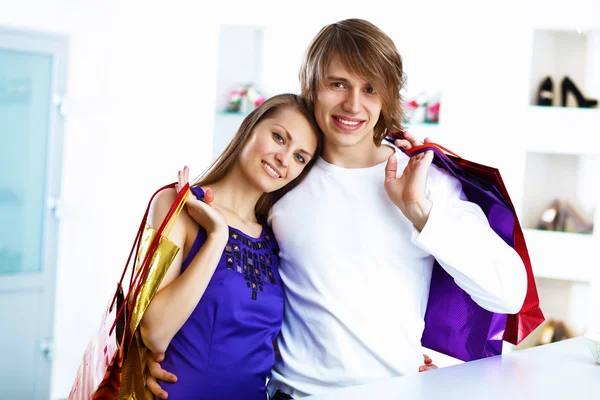 Young couple doing shopping together — Stock Photo, Image