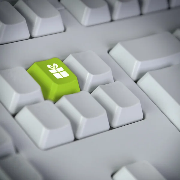 コンピューターのキーボードとギフト ボックスのシンボル — ストック写真