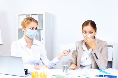 with cold and flu at work place clipart