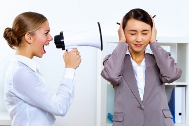 Young woman with megaphone in office clipart