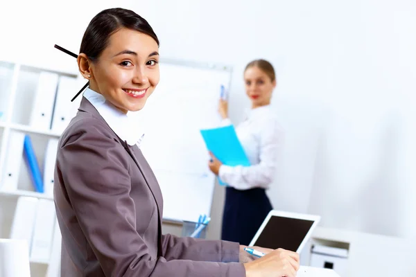 Young women in business wear working in office Royalty Free Stock Images