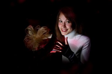 Young woman reading a magic book