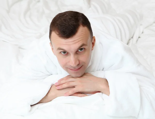 Young man in bed — Stock Photo, Image