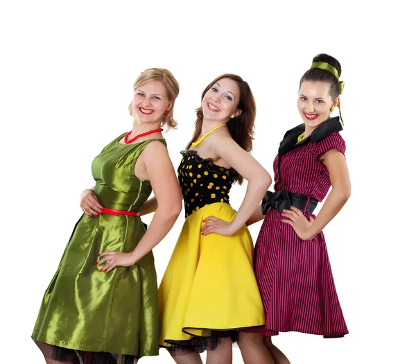 Tres mujeres jóvenes en vestidos de color brillante — Foto de Stock