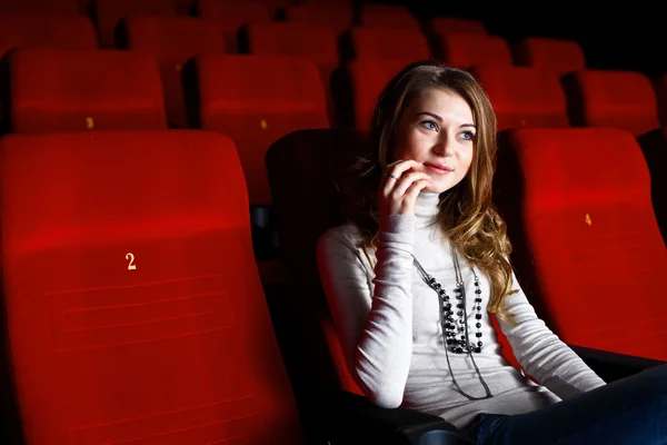 Young girl in cinema watching movie Royalty Free Stock Photos