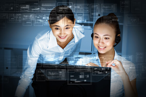 Young woman in business wear and headset