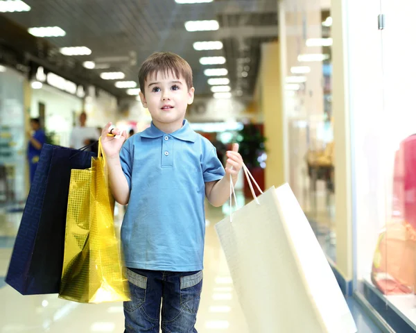 stock image Little boy doing shopping