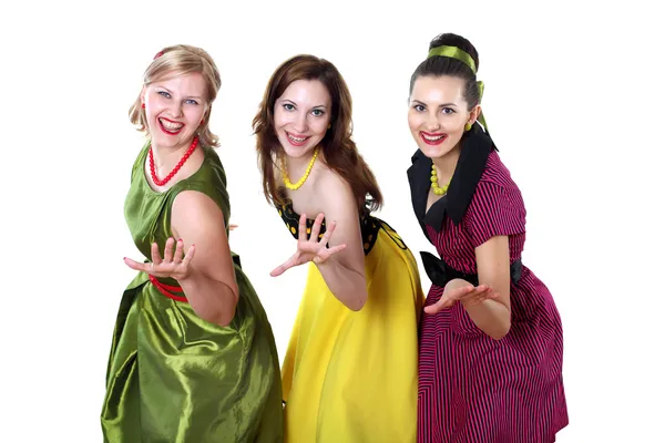 Três jovem mulher em vestidos de cor brilhante — Fotografia de Stock