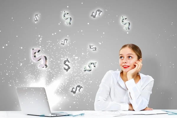 Businesswoman at workplace and money symbols — Stock Photo, Image