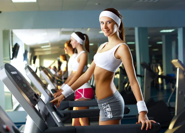 stock image Young woman doing sport in gym
