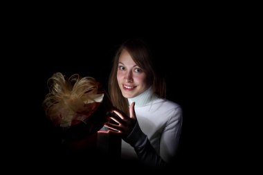 Young woman reading a magic book