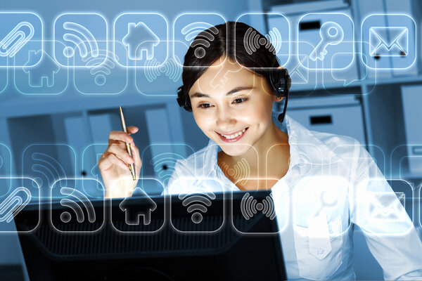 Young woman in business wear and headset