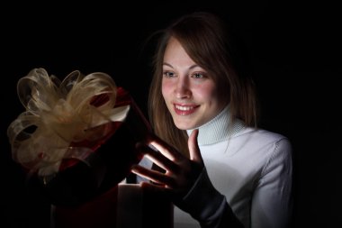 Young woman reading a magic book