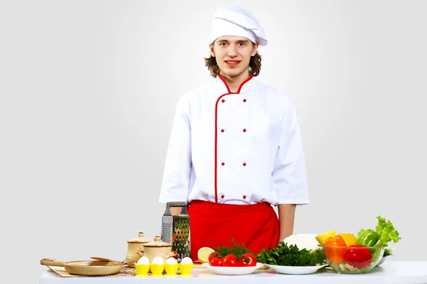 Retrato de un joven cocinero en uniforme — Foto de Stock