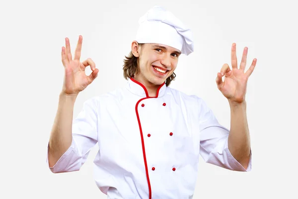 Retrato de um jovem cozinheiro em uniforme — Fotografia de Stock