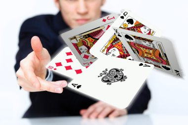 Young man showing poker cards clipart