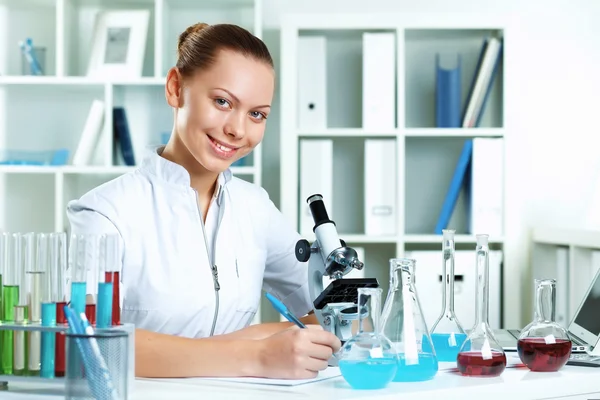 Young scientist working in laboratory Royalty Free Stock Photos