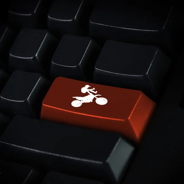 Dator tangentbord och motosport symbol — Stockfoto