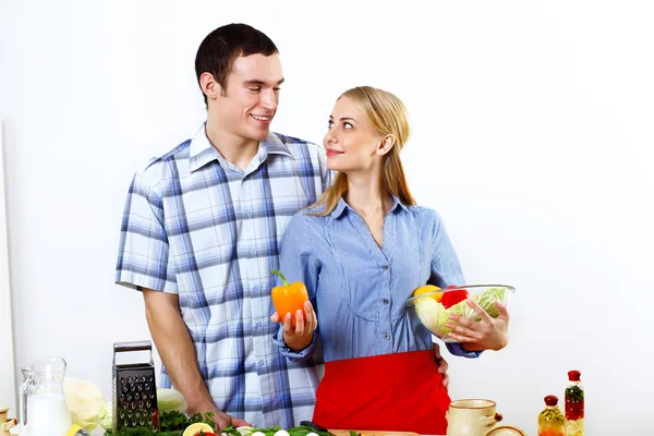 Husband and wife together coooking at home Royalty Free Stock Images