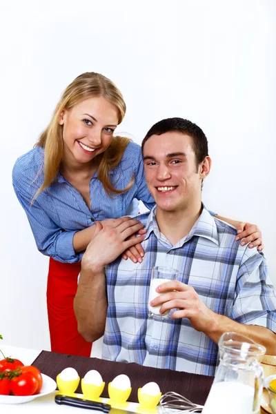 Husband and wife together coooking at home Stock Photo