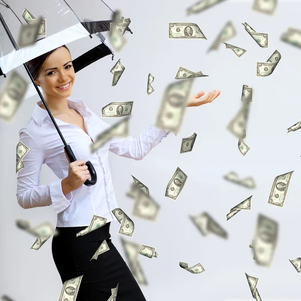 Mujer de negocios bajo lluvia de dinero con paraguas —  Fotos de Stock