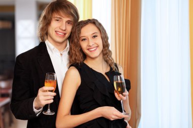 Couple in a restaurant with shampagne clipart