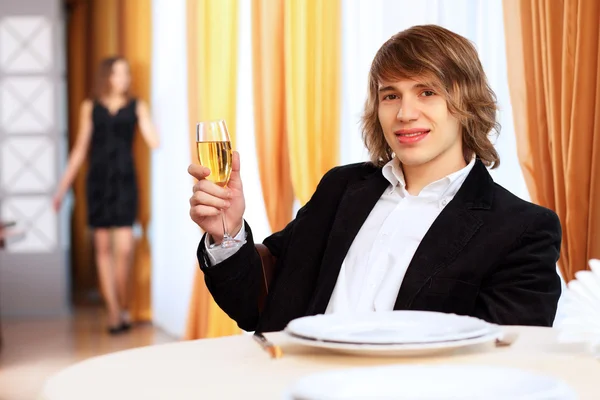 stock image Young handsome man sitting in restaurant