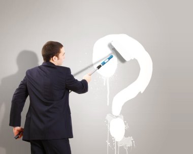 Businessman with paint brash and question mark clipart