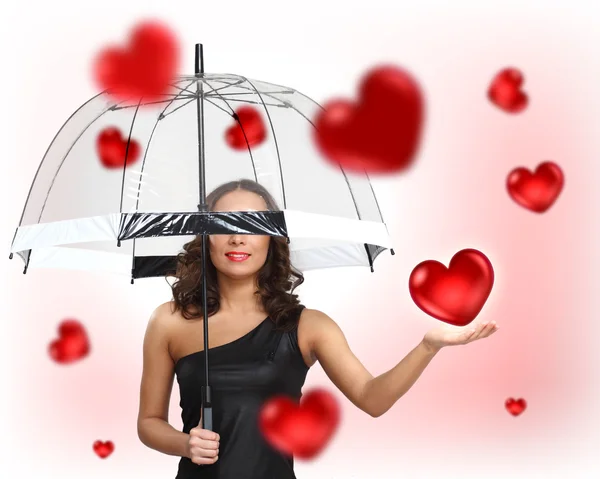 Mulher bonita com guarda-chuva e corações — Fotografia de Stock