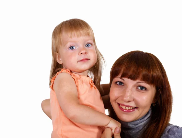 Junge Mutter mit kleiner Tochter lizenzfreie Stockfotos
