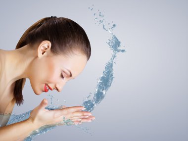 Young woman with water splashes clipart