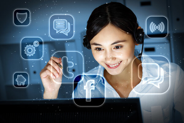 Young woman in business wear and headset