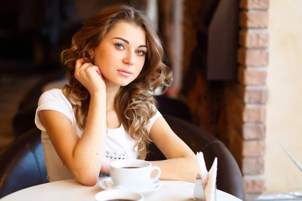 stock image Young pretty woman sitting in restaurant