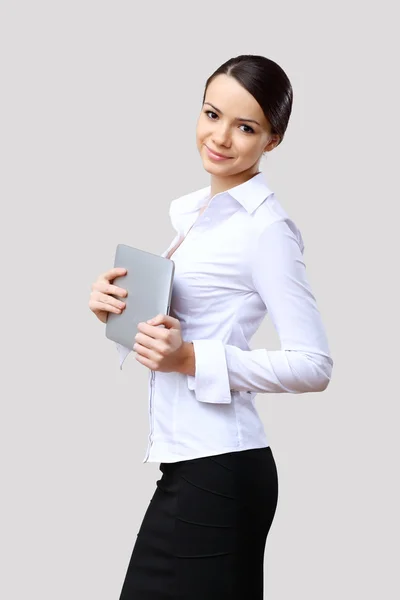 Jonge mooie vrouw in zakelijke slijtage op het werk — Stockfoto