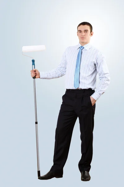 Young businesswoman with a paint brush — Stock Photo, Image