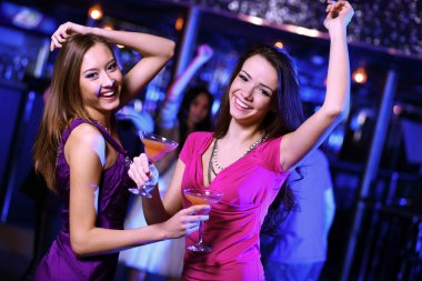 Young woman having fun at nightclub disco clipart