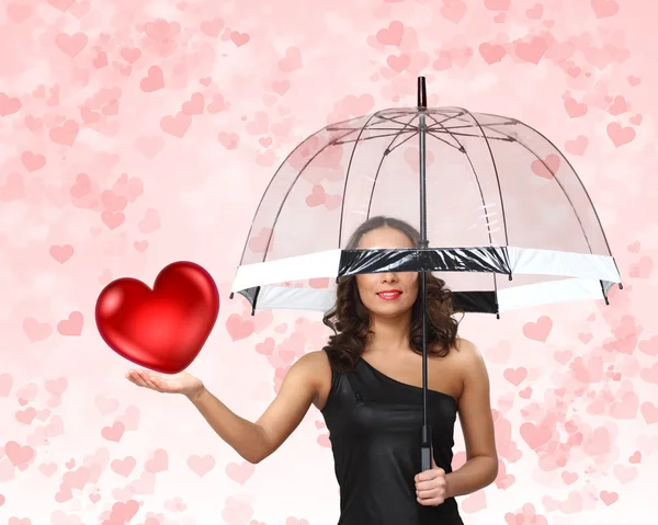 Bella giovane donna con ombrello e cuori — Foto Stock