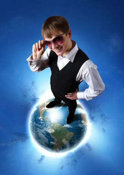 Young businessman and our planet earth — Stock Photo, Image