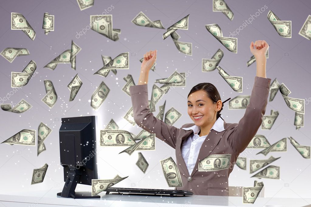 Businesswoman at workplace and money symbols