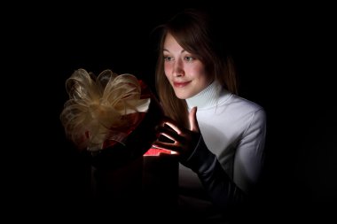 Young woman reading a magic book