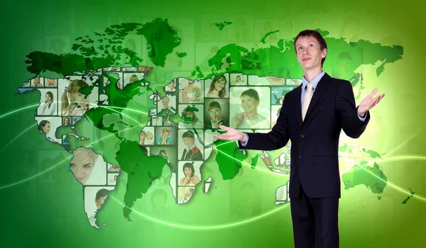 Young man against world map background — Stock Photo, Image