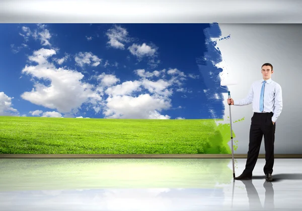 Young businessman and nature background — Stock Photo, Image