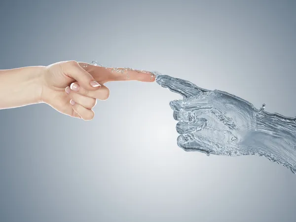 Zwei menschliche Hände berühren einander — Stockfoto