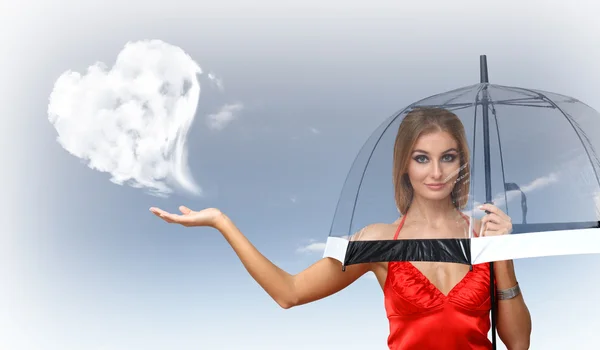 Mooie jonge vrouw met paraplu en harten — Stockfoto